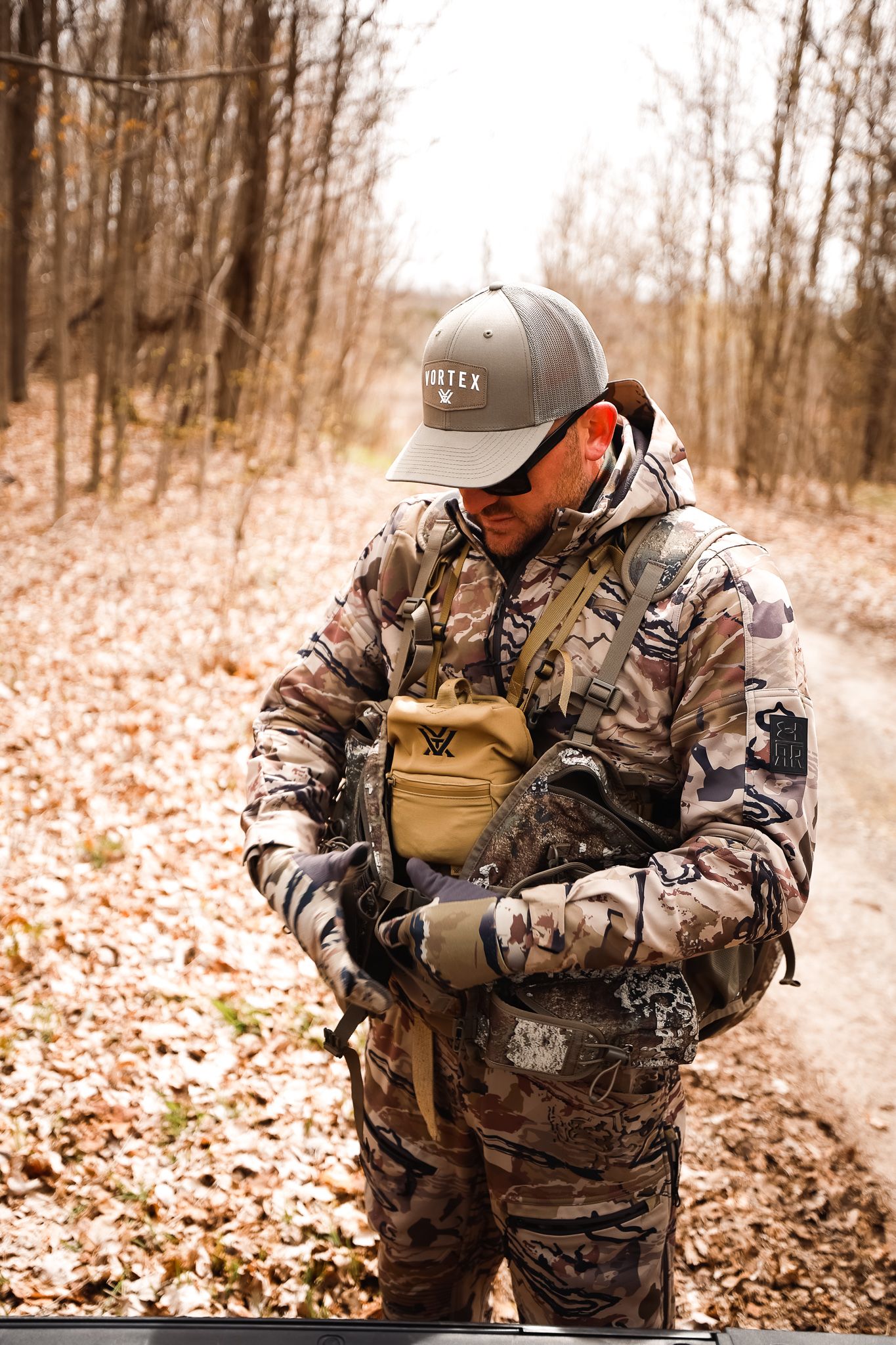 A hunter checks his gear for turkey hunting. 