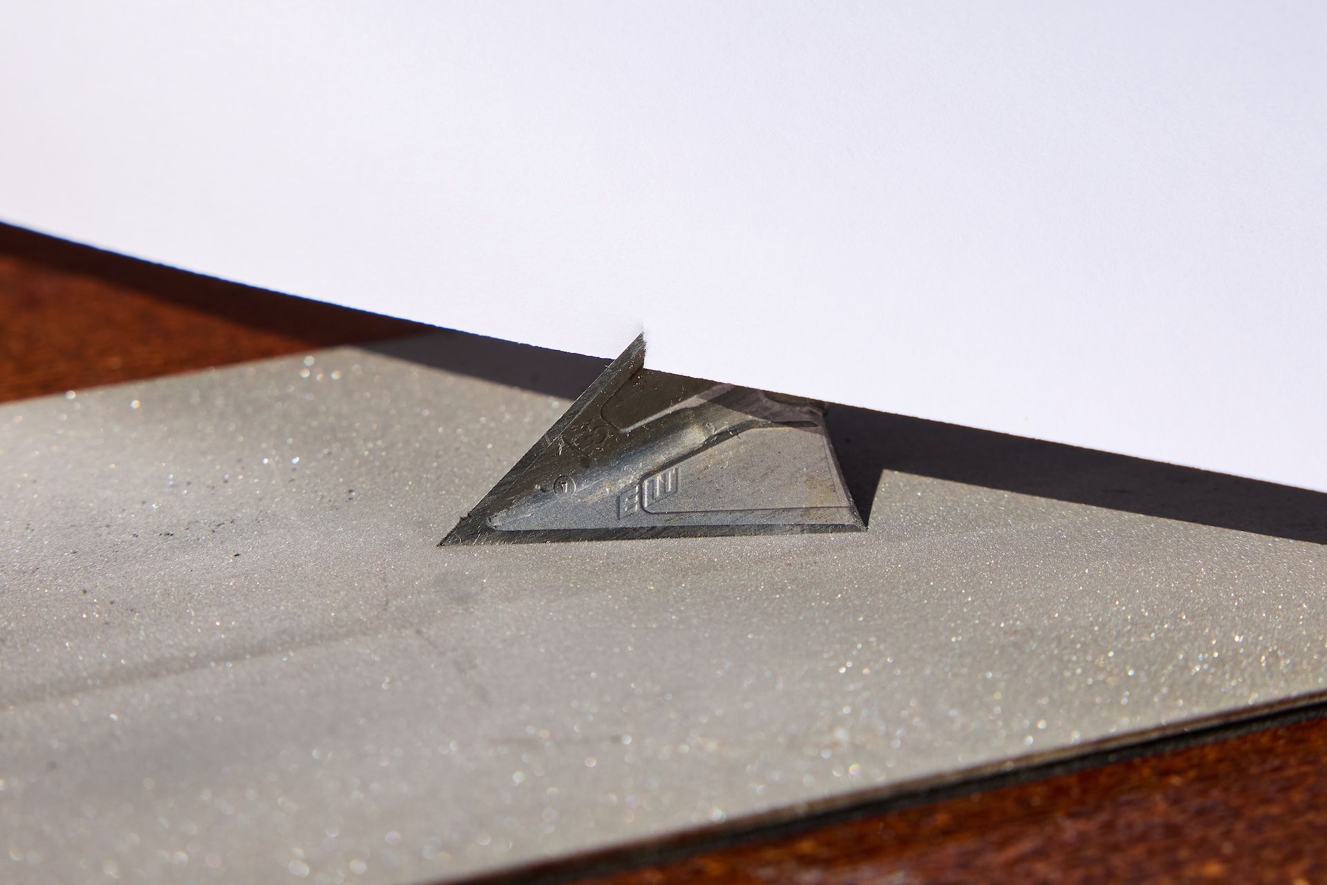 A broadhead against paper, how to test broadhead sharpness concept. 