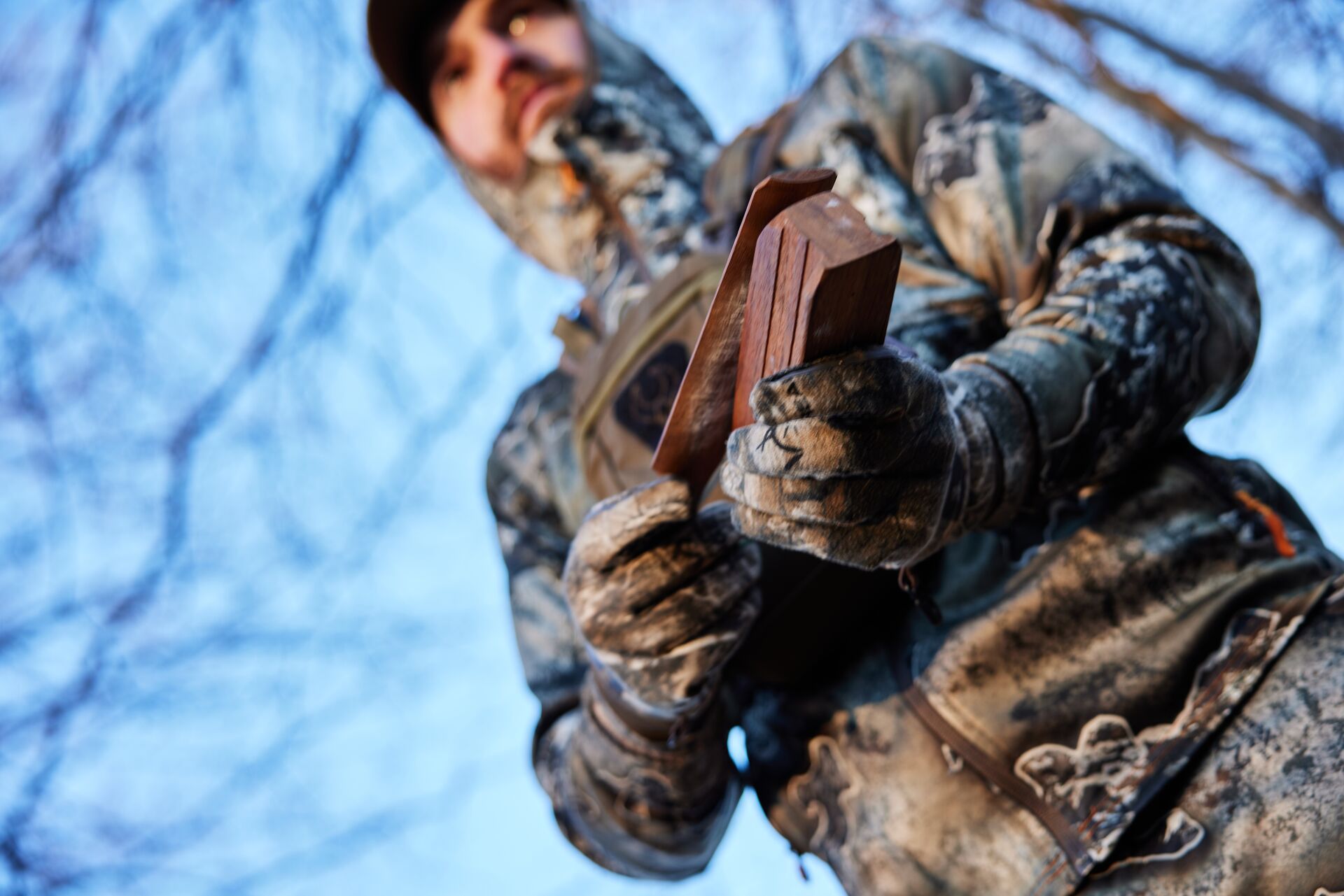 Close-up of a turkey box call in a hunter's hands, turkey box call techniques concept. 