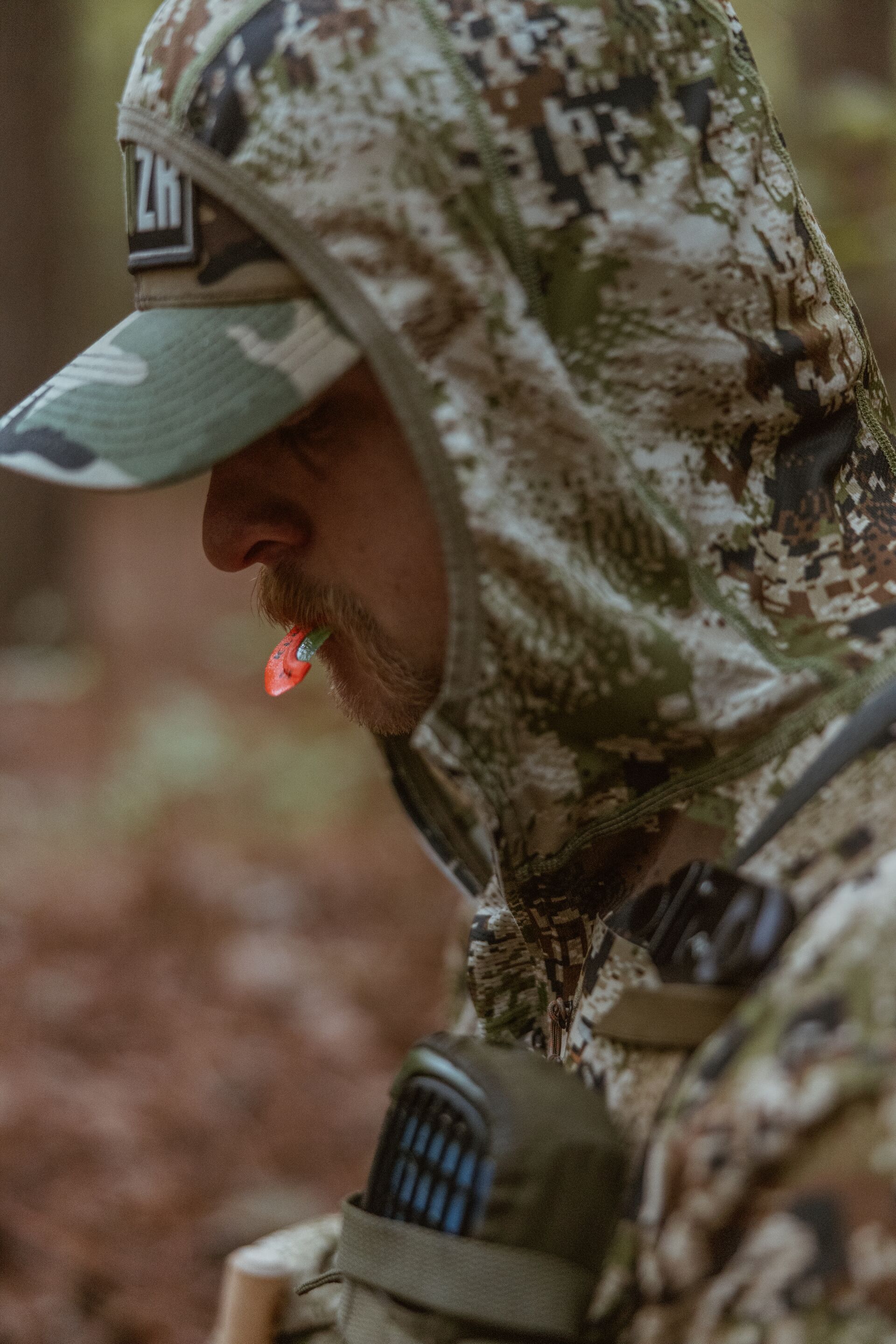 Hunter with a diaphragm turkey call in his mouth. 
