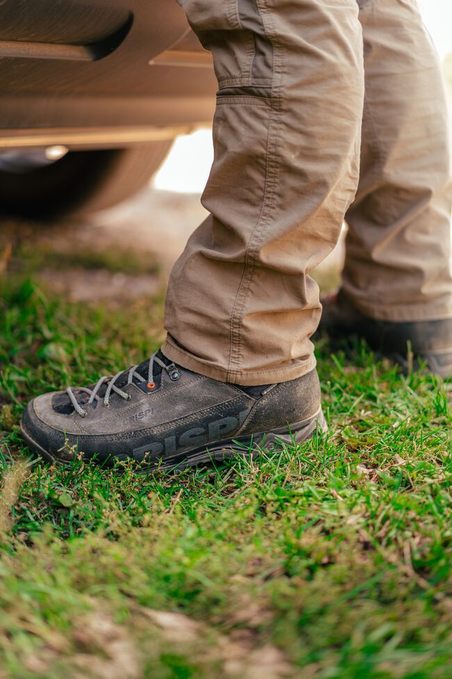 Close-up of a hunter's feet and hunting boots. 