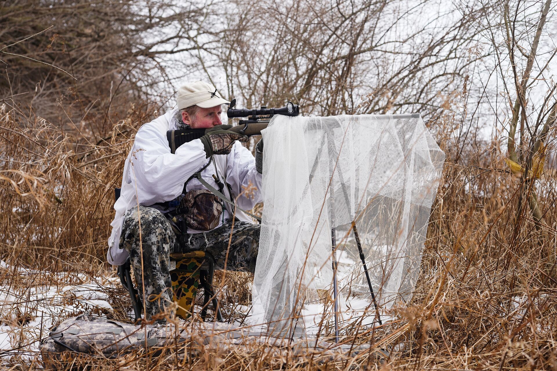 A coyote hunter set up in the brush. 