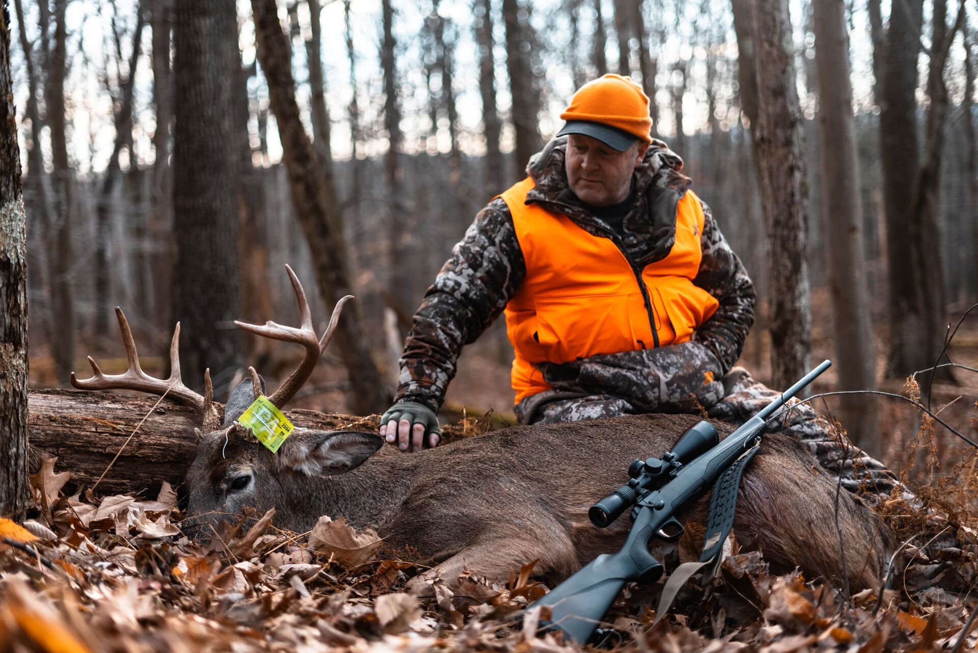 Hunt Jeff Sturgis with a deer kill and a rifle, where to shoot a deer concept. 