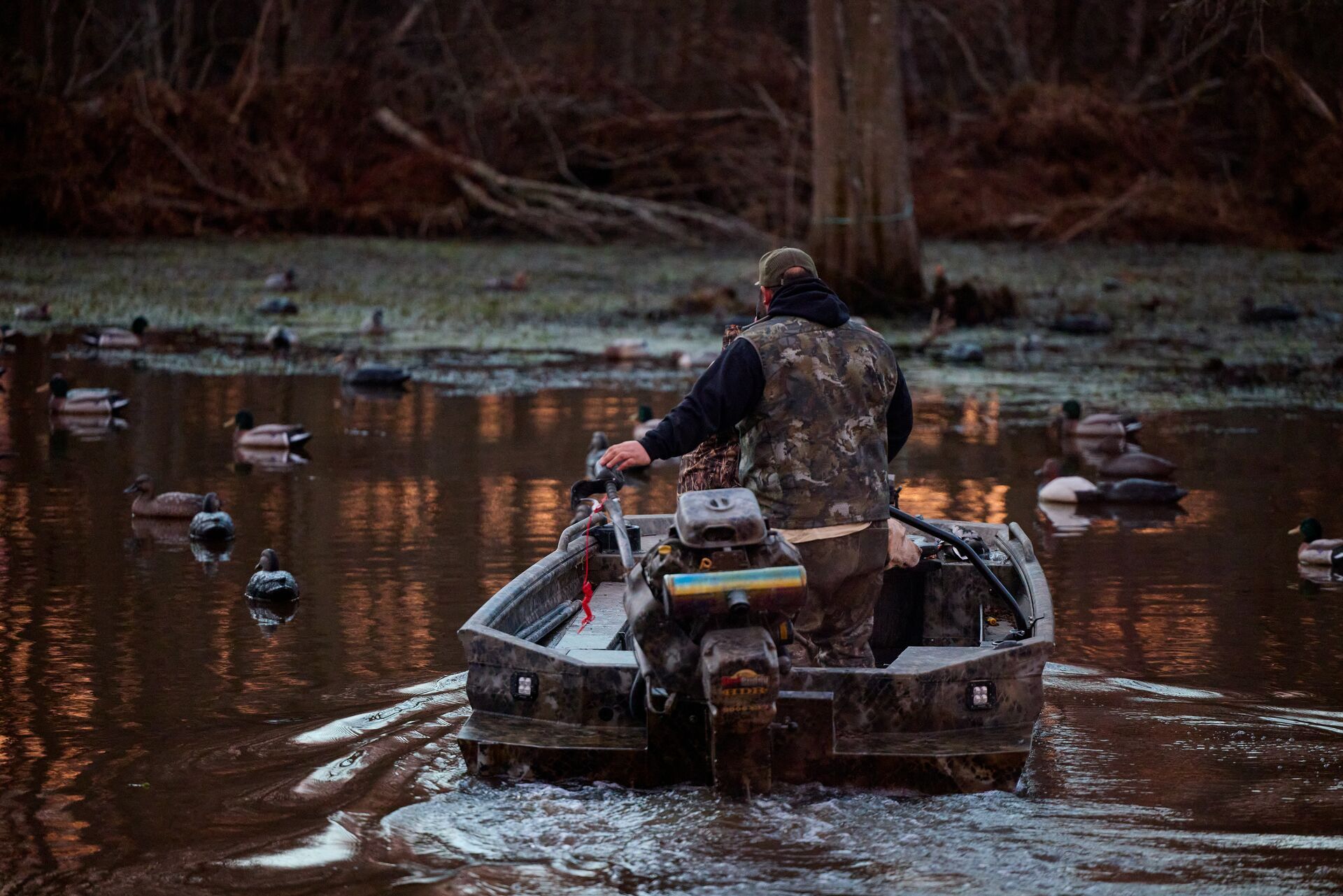 Hunters on a boat to hunt ducks, find duck hunting spots concept.