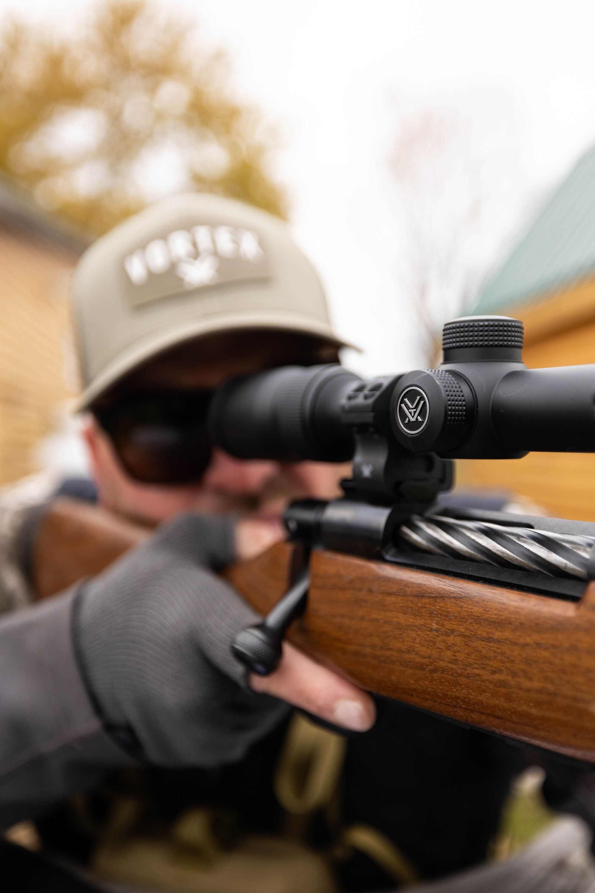 Hunter fires a bolt action rifle, dry fire drills concept. 
