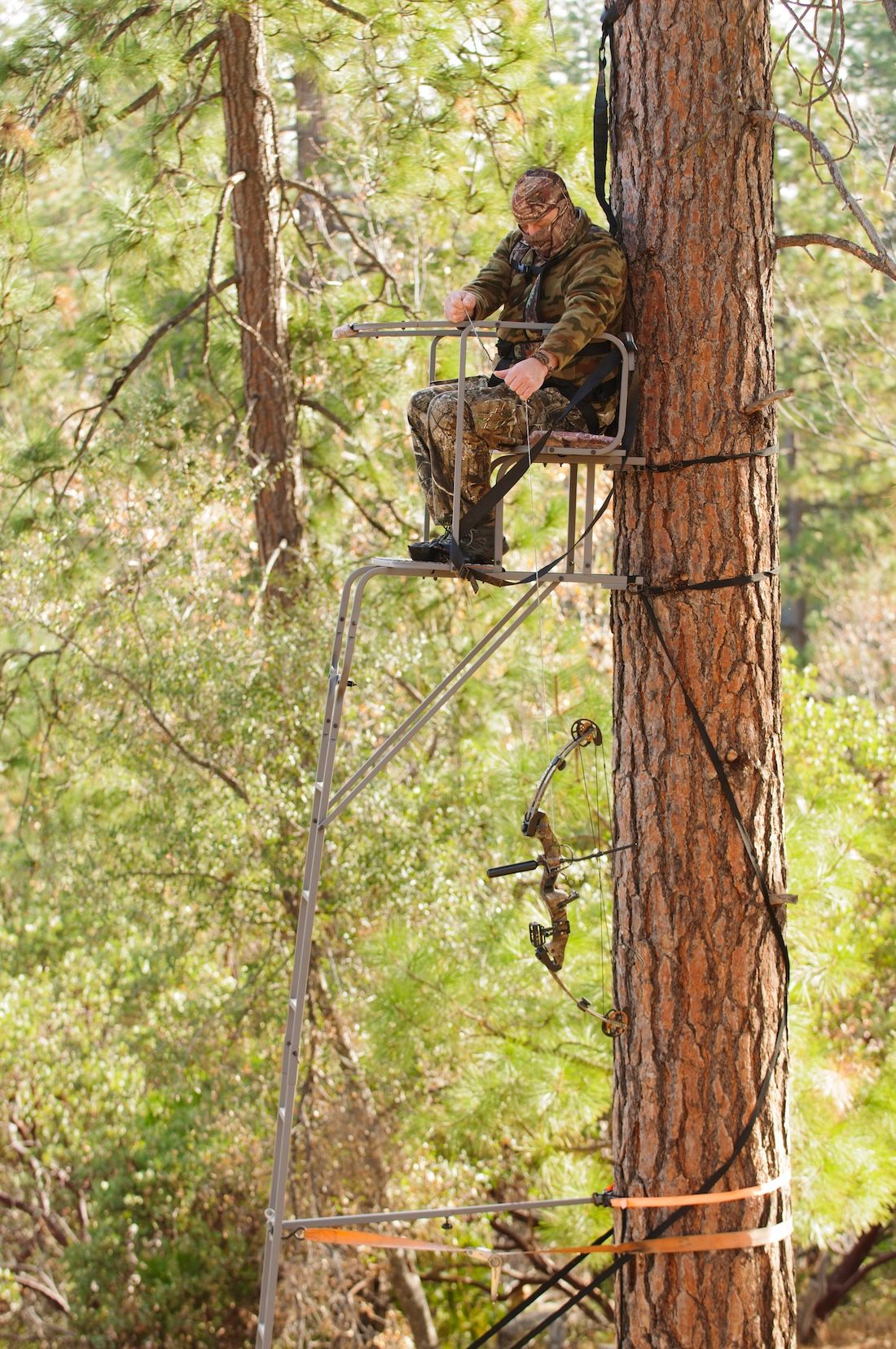 FGBLOG hunter in ladder stand hauling gear.jpeg