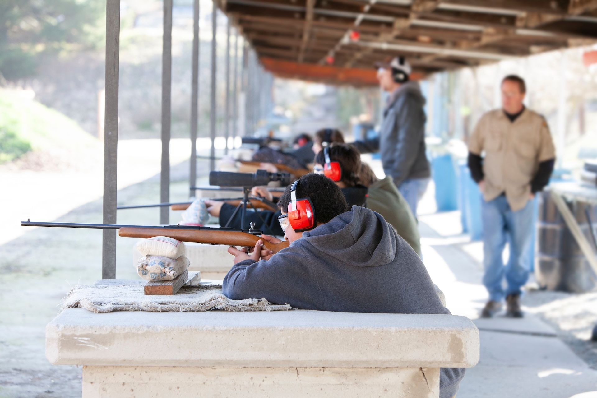 Hunter in sitting firing position at the range. 