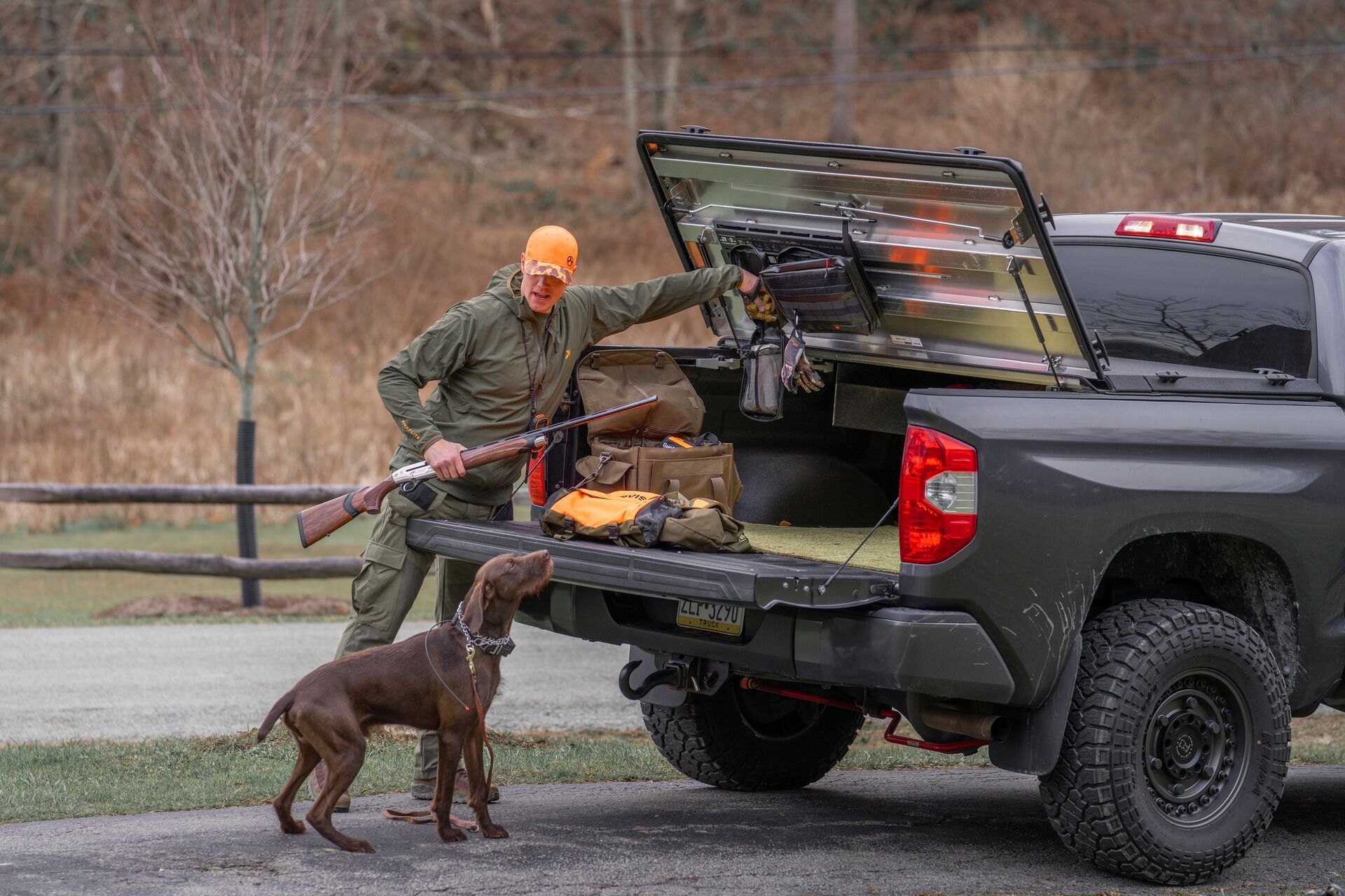 FGBLOG hunter with dog opens back of truck.jpeg