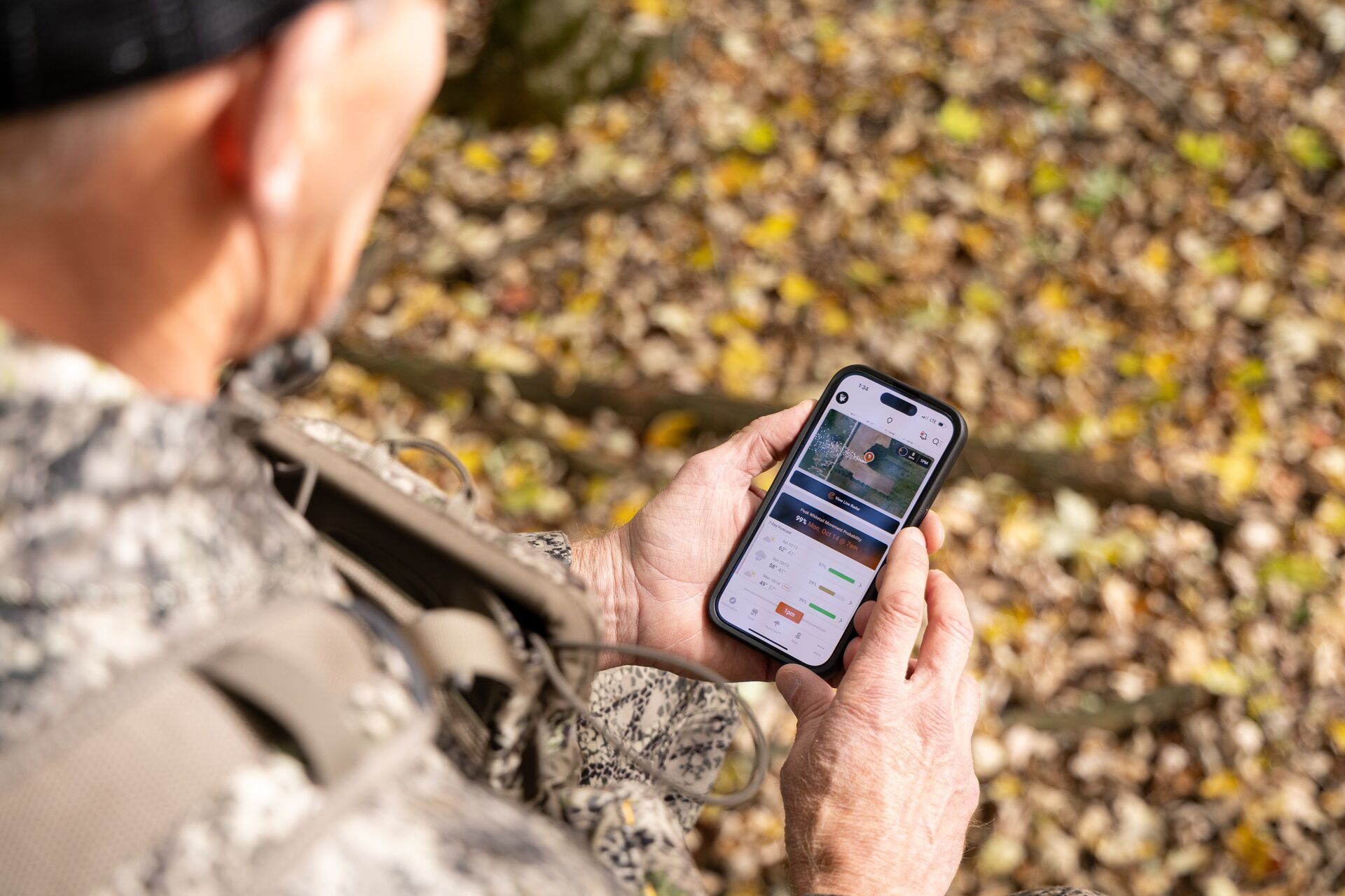 A hunter uses the HuntWise app on a phone to plan a hunt.