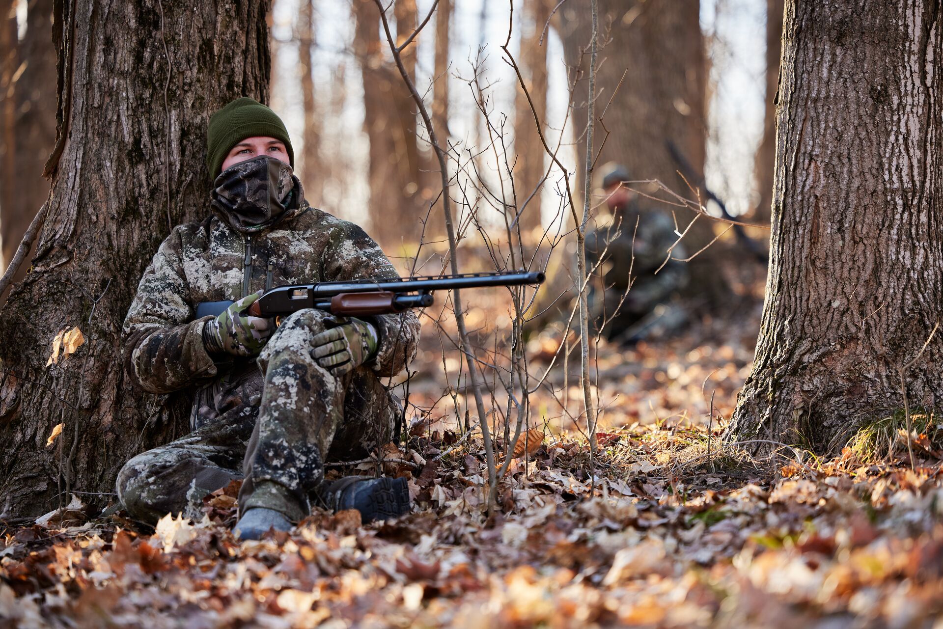 FGBLOG hunter with shotgun sits against tree for turkey hunt.jpeg