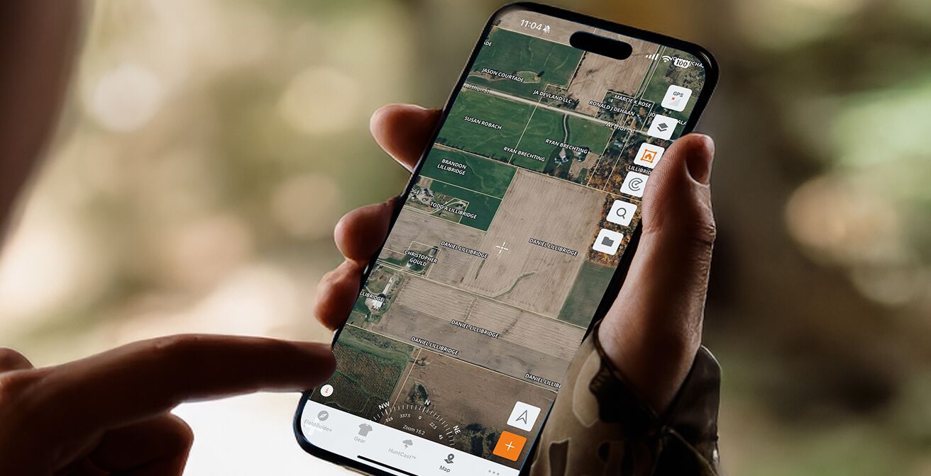 Phone screen showing property lines in the HuntWise app, deer hunting land concept. 