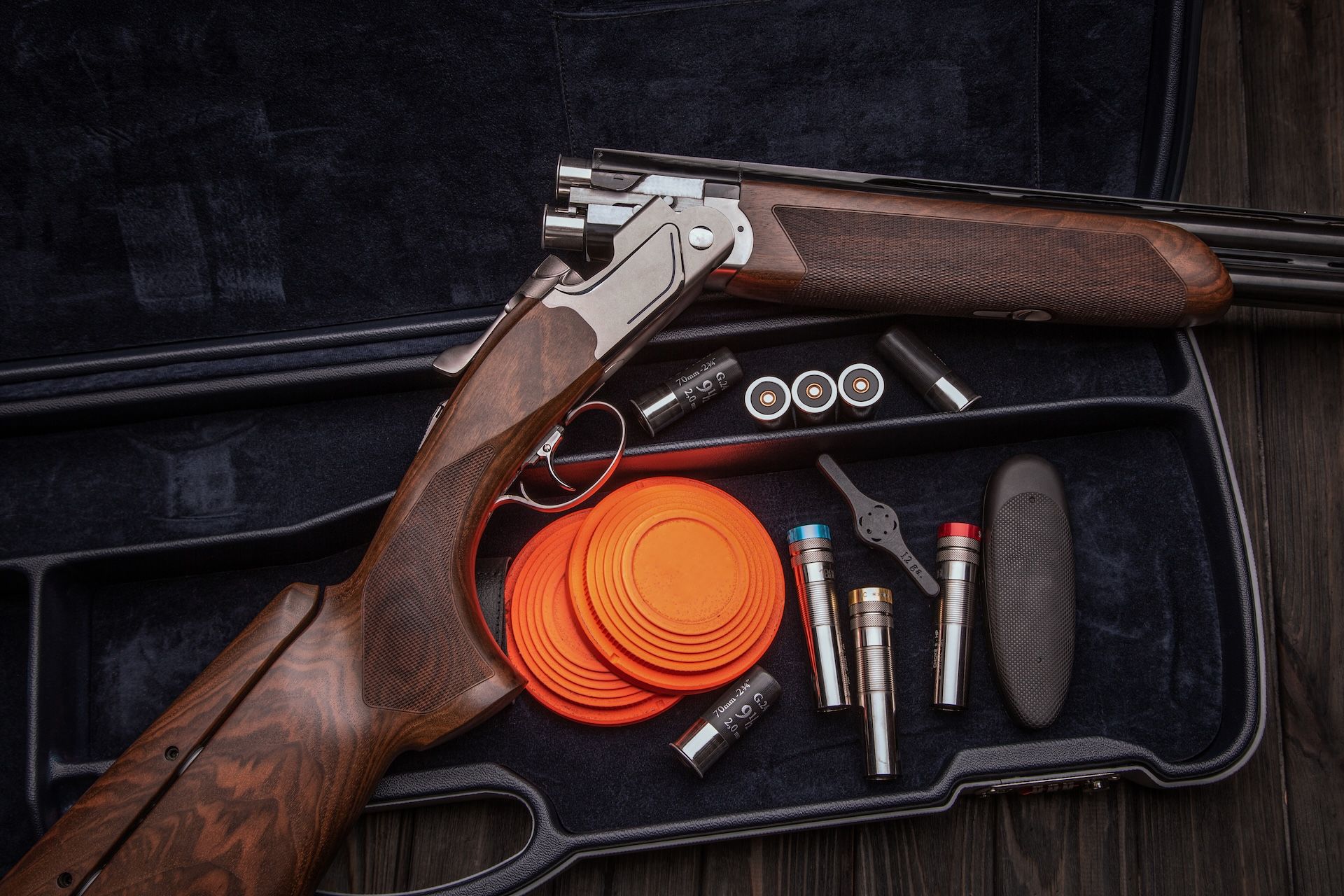 Shotgun with chokes and accessories, what choke is best for dove hunting concept.