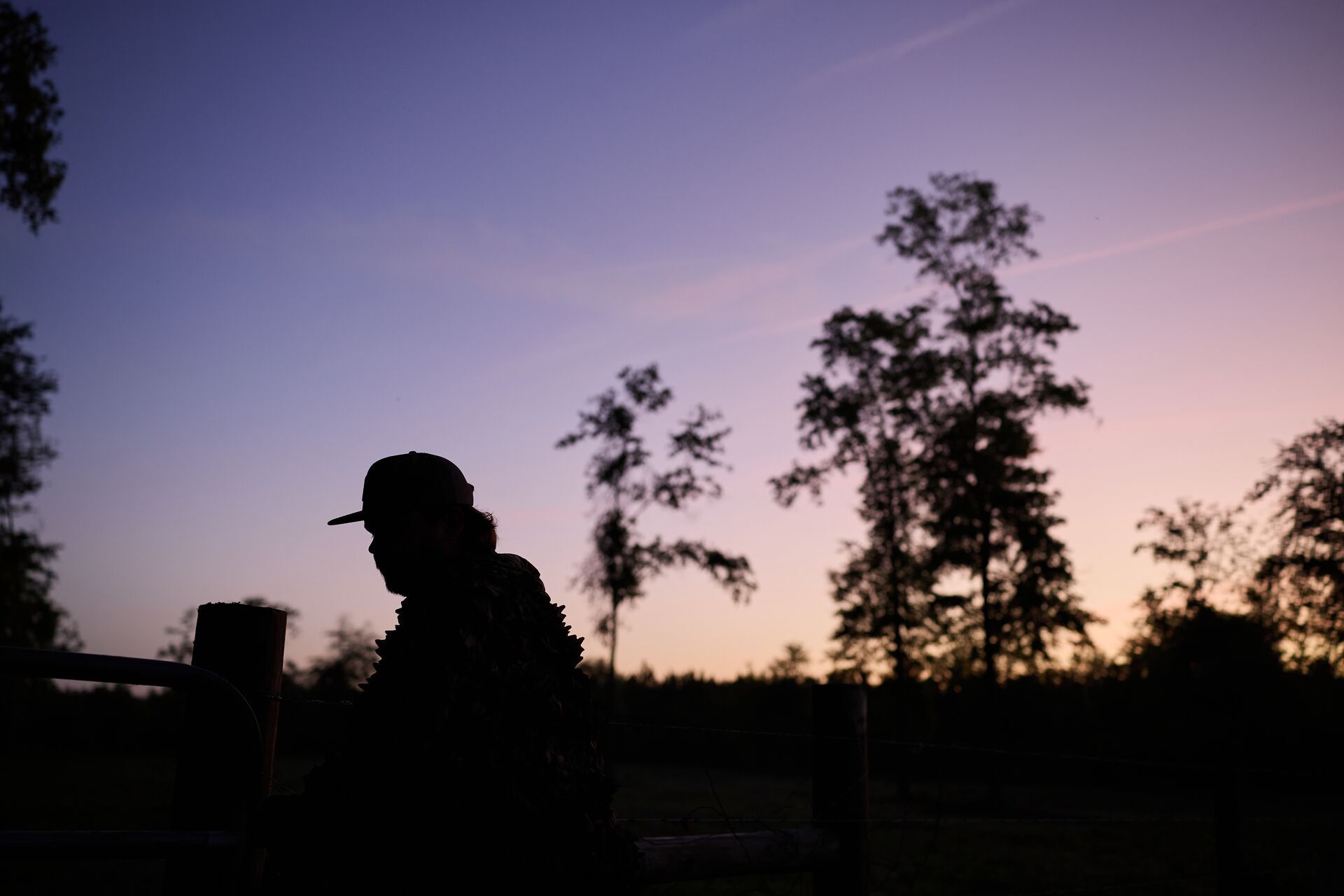 Silhouette of a hunter, represents hog hunting at night.