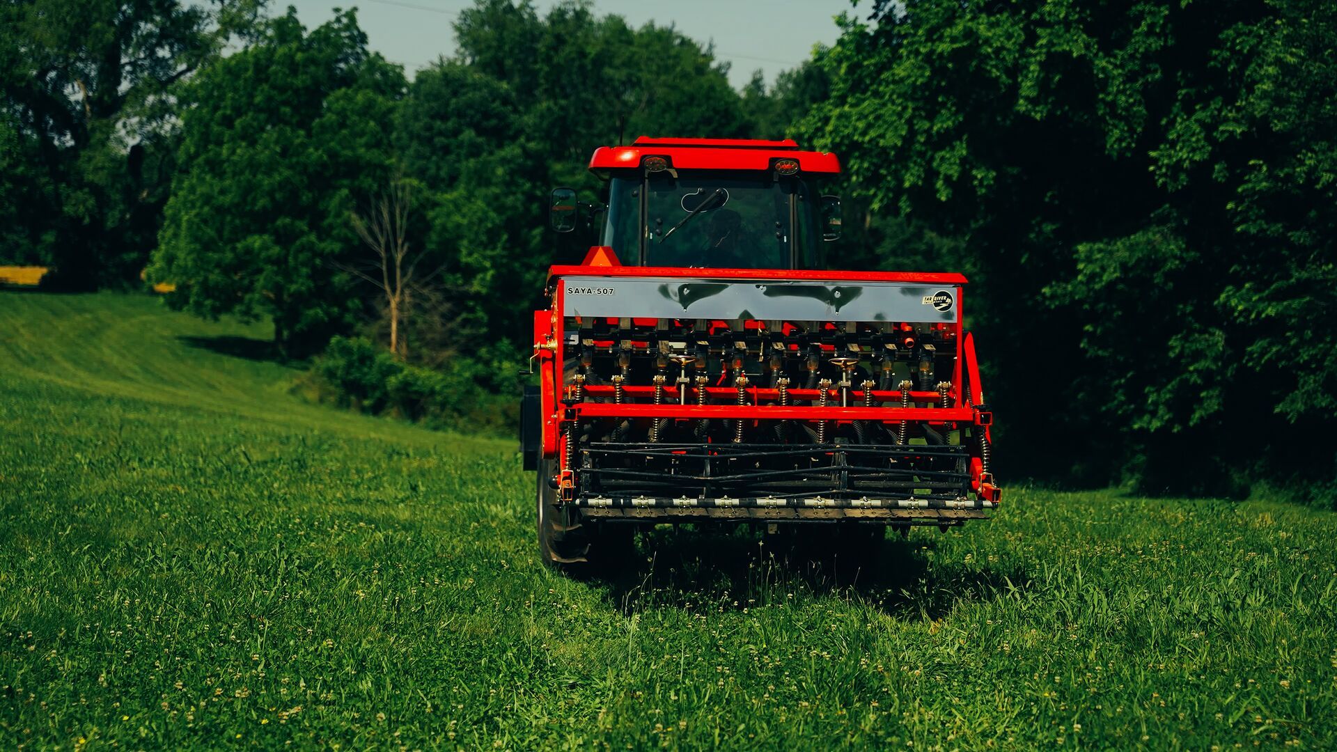 Tractor on a food plot for planting, food plot equipment concept.