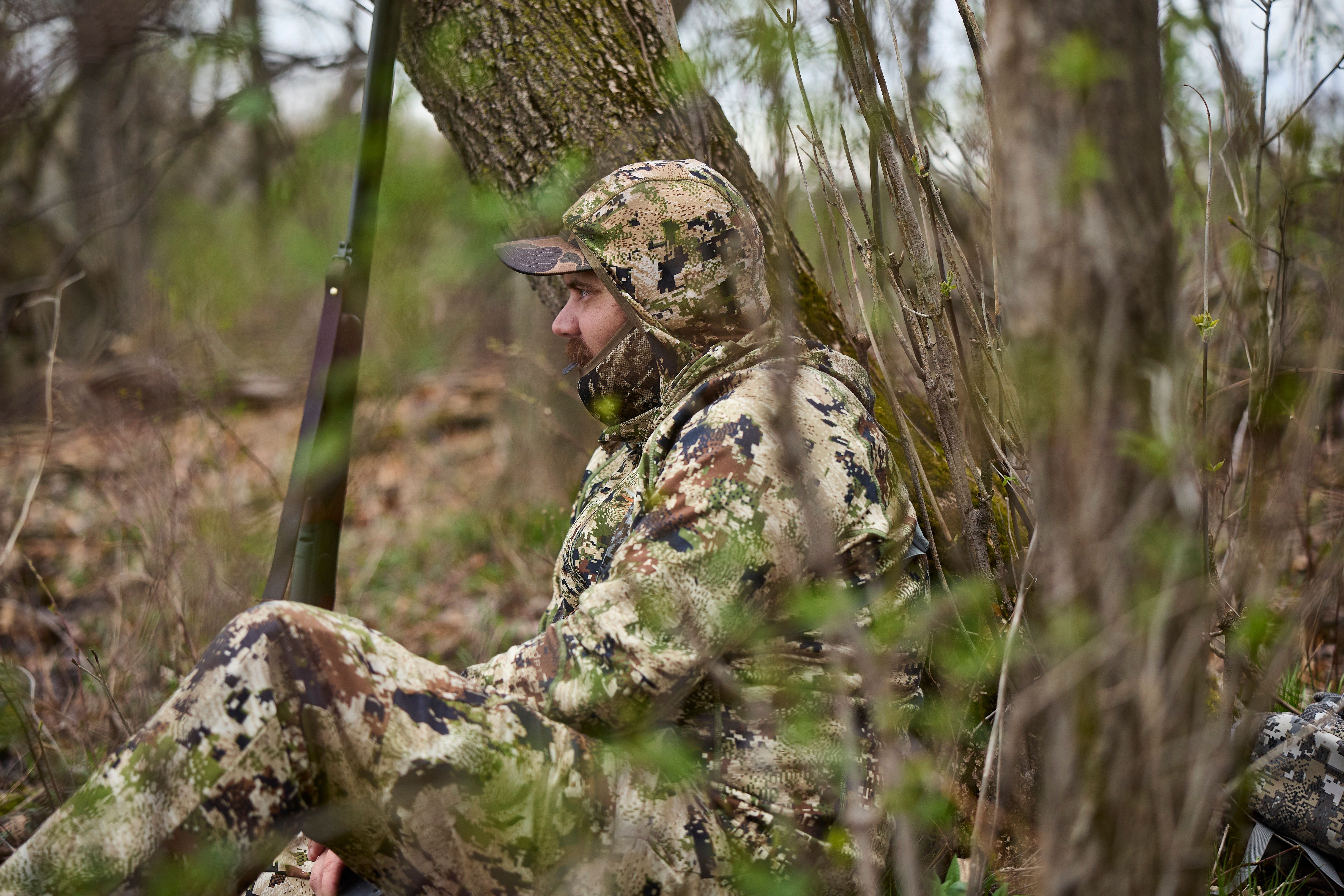 A hunter waits in the woods, Minnesota turkey season concept. 