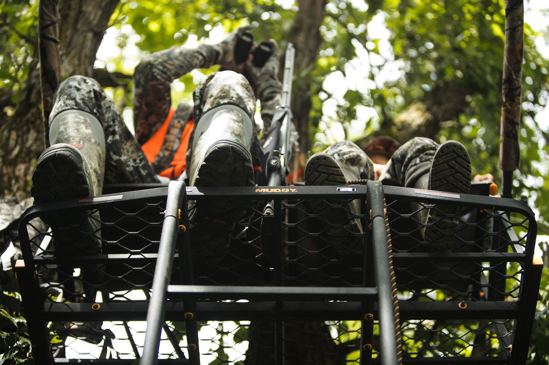 Hunters in a treestand.