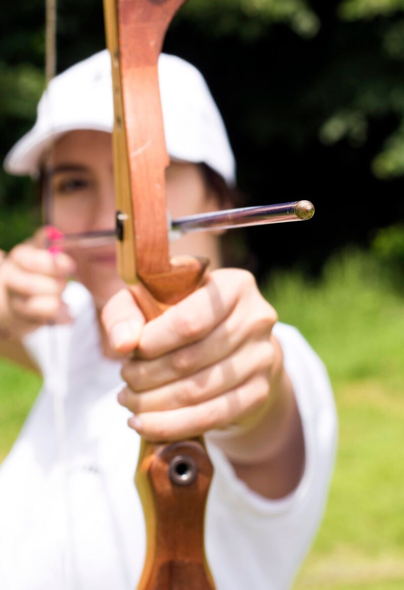 woman aiming recurve bow.jpeg